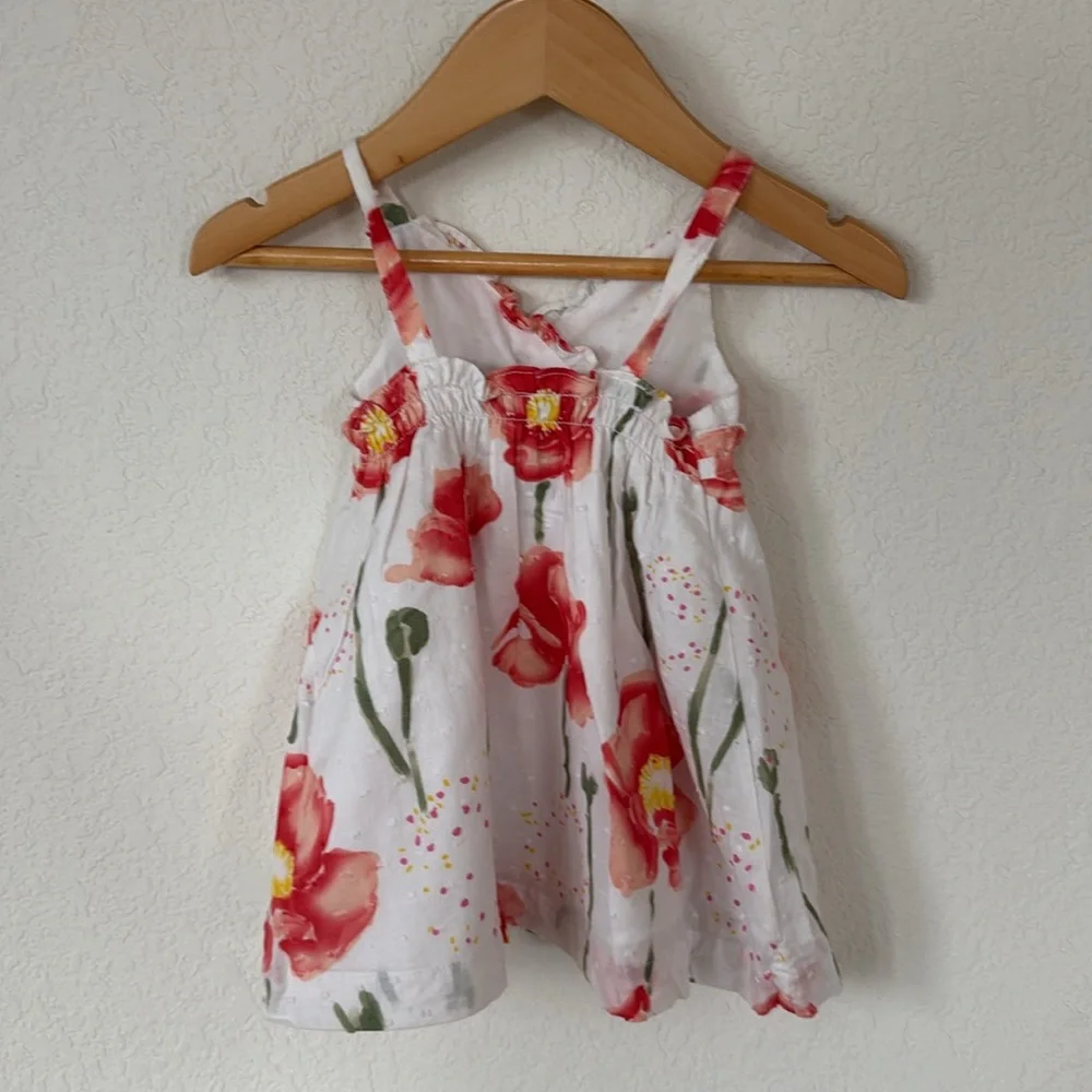Penelope Mack • White Dress with Swiss Dots and Red & Green Floral Detailing